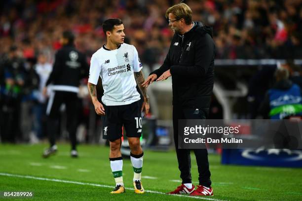Philippe Coutinho o Liverpool speaks to Jurgen Klopp, Manager of Liverpool during the UEFA Champions League group E match between Spartak Moskva and...
