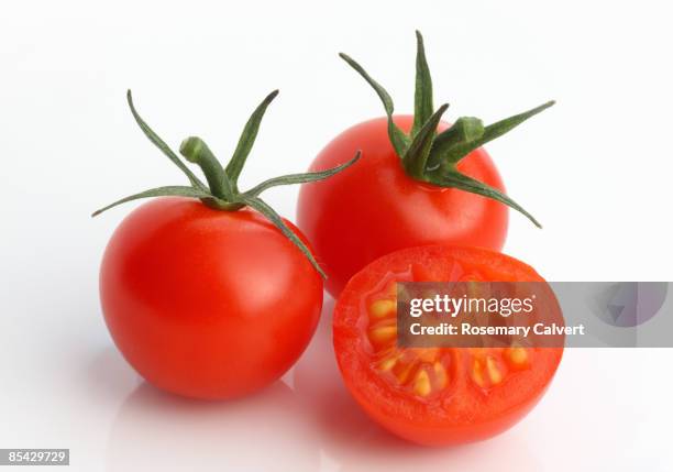 cherry tomatoes in close up - tomate stock pictures, royalty-free photos & images