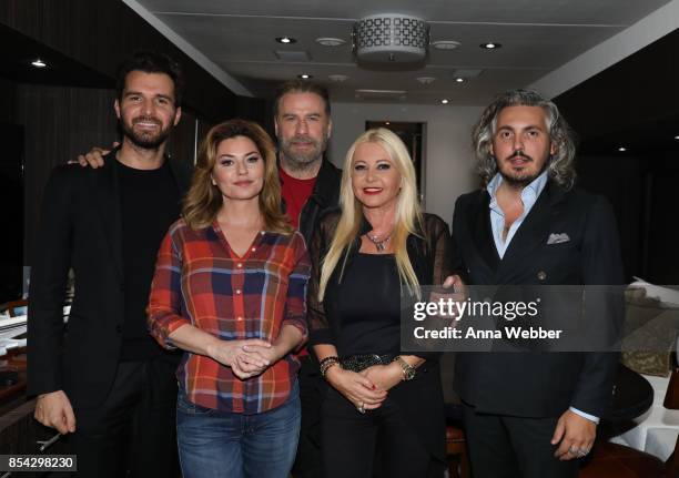 Producer and founder of AMBI Media Group Andrea Iervolino, Shania Twain, John Travolta, producer and founder of AMBI Media Group Monika Bacardi, and...