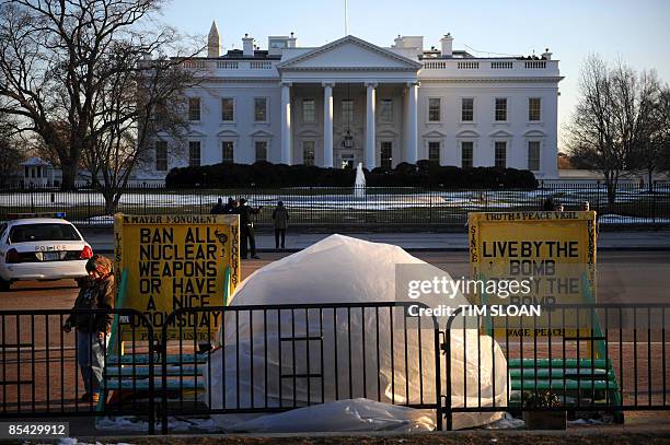 Concepcion Picciotto stands near her signs and hut across the street from the White House March 4, 2009 in Washington, DC. Picciotto has lived in...