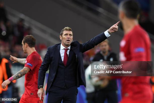 Spartak Moscow's coach from Italy Massimo Carrera gives instructions from the touchline during the UEFA Champions League Group E football match...
