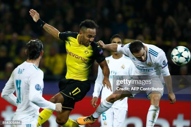 Dortmund's Gabonese forward Pierre-Emerick Aubameyang and Real Madrid's defender from Spain Dani Carvajal vie for the ball during the UEFA Champions...
