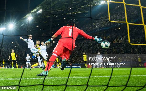 Dortmund's Gabonese forward Pierre-Emerick Aubameyang scores past Real Madrid's goalkeeper from Costa Rica Keylor Navas during the UEFA Champions...