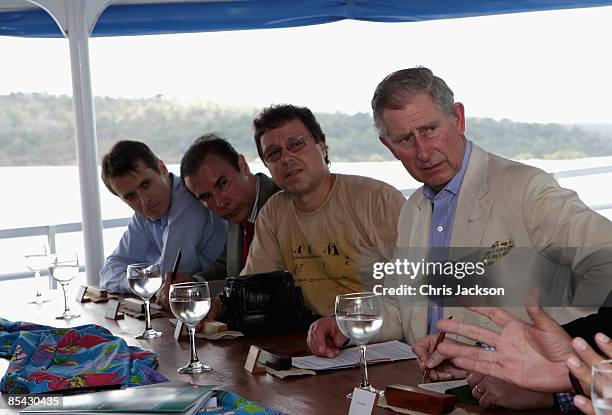 Prince Charles, Prince of Wales chairs a meeting on climate change on board a boat on the Amazon at Santaram on March 14, 2009 in Manaus, Brazil. The...