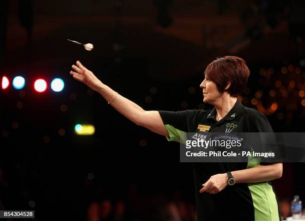 Lisa Ashton in action against Anastasia Dobromyslova during the BDO World Professional Darts Championships at the Lakeside Complex, Surrey.