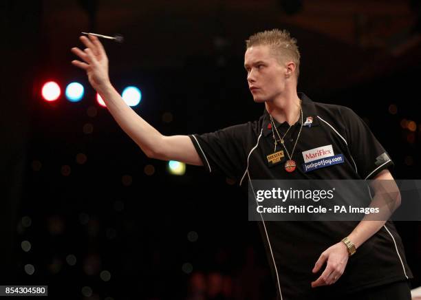 Wesley Harms in action against Tony O'Shea during the BDO World Professional Darts Championships at the Lakeside Complex, Surrey.