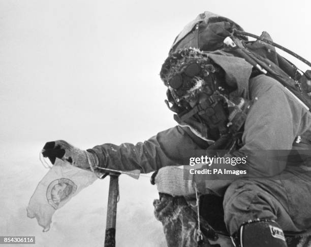 Corporal 'Bronco' Lane fixes a commemorative pennant on the summit of Mount Everest, after he and Sergeant 'Brummie' Stokes arrived there on May 16th.