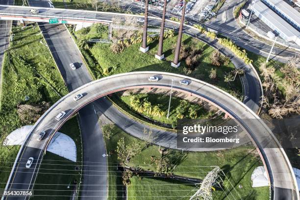 Vehicles drive down highways in this aerial photograph taken above the municipality of Cantano in Puerto Rico, on Monday, Sept. 25, 2017. Hurricane...