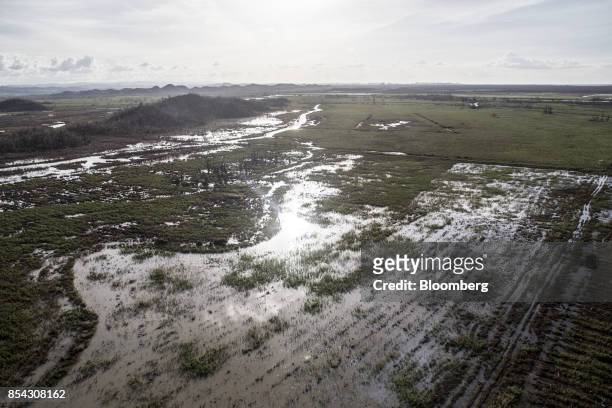 Floodwaters are seen the field of a farm after Hurricane Maria in this aerial photograph taken near San Juan, Puerto Rico, on Monday, Sept. 25, 2017....