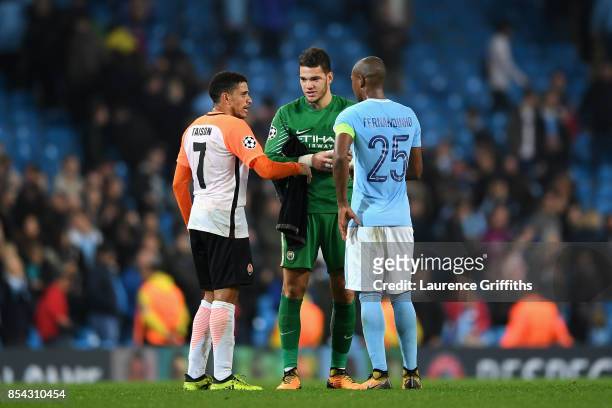 Taison of Shakhtar Donetsk speaks to Ederson of Manchester City and Fernandinho of Manchester City during the UEFA Champions League Group F match...