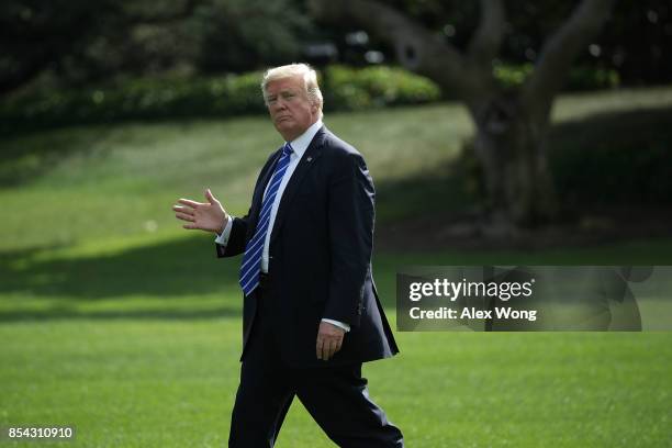 President Donald Trump waves as he walks on the South Lawn prior to his departure from the White House September 26, 2017 in Washington, DC....