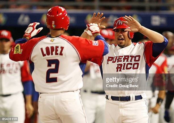 Geovany Soto of Puerto Rico congratulates Felipe Lopez after Lopez's two-run home run in the second inning against the United States during round 2...