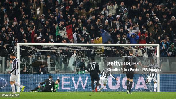 Juventus fans celebrate in the stands after Alessandro Matri scores his side's first goal of the game