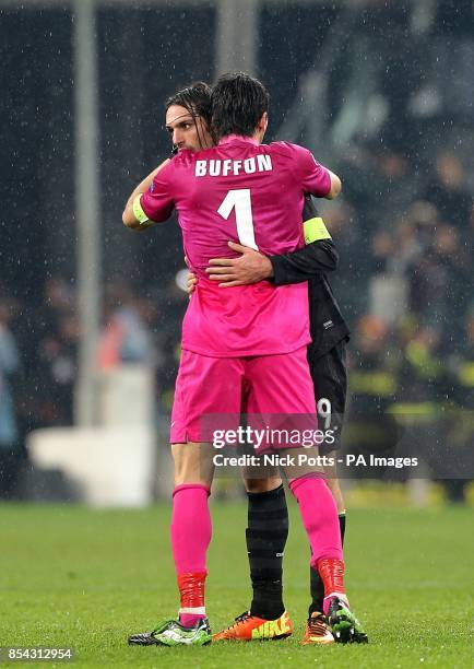 Juventus goalkeeper Gianluigi Buffon hugs Celtic's Georgios Samaras after the final whistle