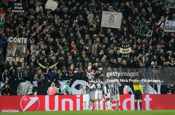 Juventus players celebrate their side's second goal of the game in front of the home fans