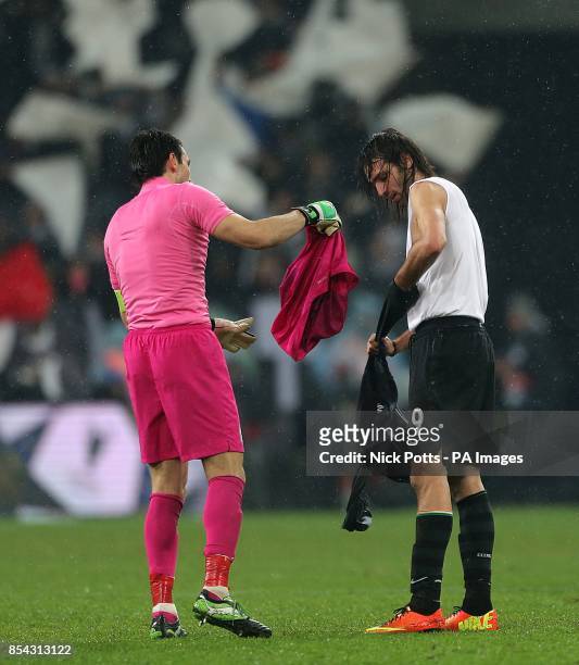 Juventus goalkeeper Gianluigi Buffon and Celtic's Georgios Samaras swap shirts after the final whistle