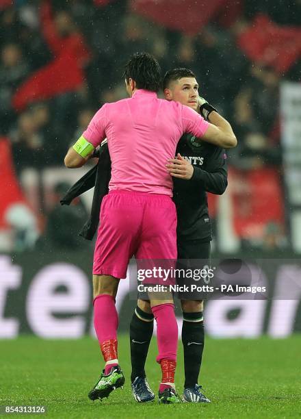 Juventus goalkeeper Gianluigi Buffon and Celtic's Gary Hooper hug after the final whistle