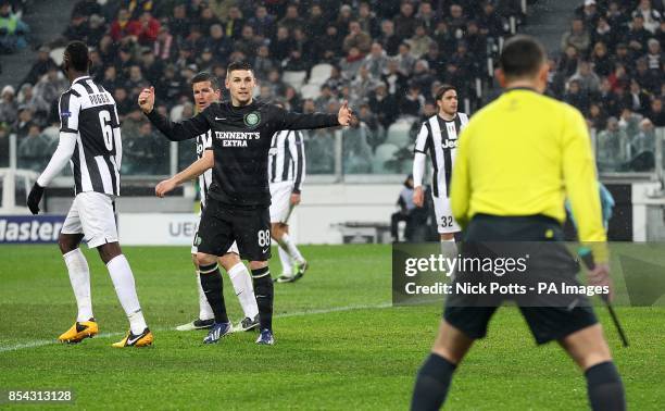 Celtic's Gary Hooper complains to the assistant referee about holding in the penalty area