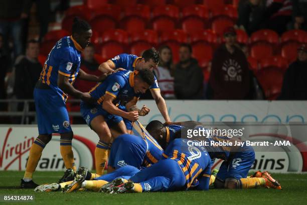 Arthur Gnahoua of Shrewsbury Town celebrates after scoring a goal to make it 1-2 during the Sky Bet League One match between Doncaster Rovers and...