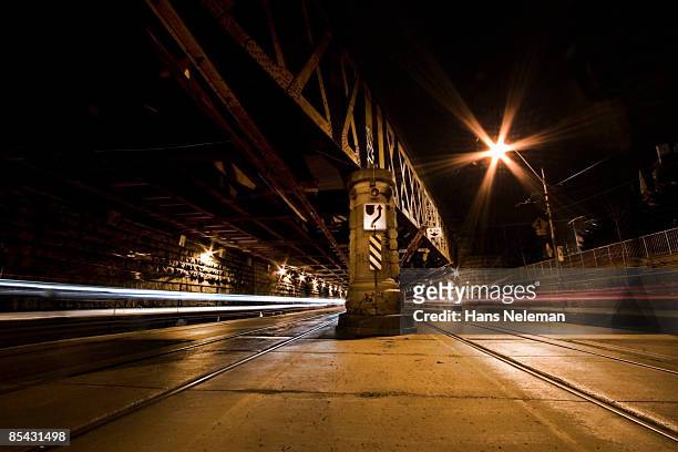 railway underpass showing the passage of cars. - toronto night stock pictures, royalty-free photos & images
