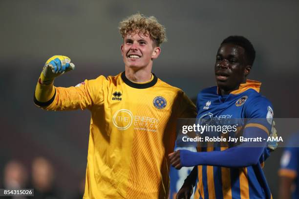 Dean Henderson of Shrewsbury Town and Arthur Gnahoua of Shrewsbury Town celebrate at full time during the Sky Bet League One match between Doncaster...