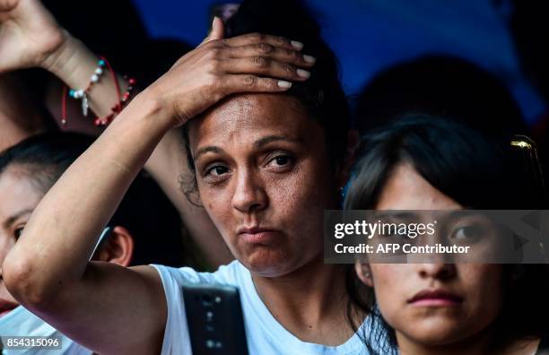 Relatives of people who are presumed still buried under the rubble from a building toppled by the 7.1-magnitude quake that struck central Mexico one...