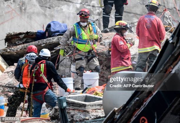 Rescuers keep on digging for survivors still buried under the rubble from a building toppled by the 7.1-magnitude quake that struck central Mexico...