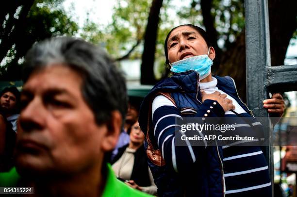 Relatives of people who are presumed still buried under the rubble from a building toppled by the 7.1-magnitude quake that struck central Mexico one...