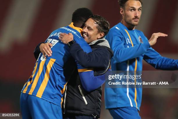 Paul Hurst, Manager / Head Coach of Shrewsbury Town and Arthur Gnahoua of Shrewsbury Town celebrate at full time during the Sky Bet League One match...