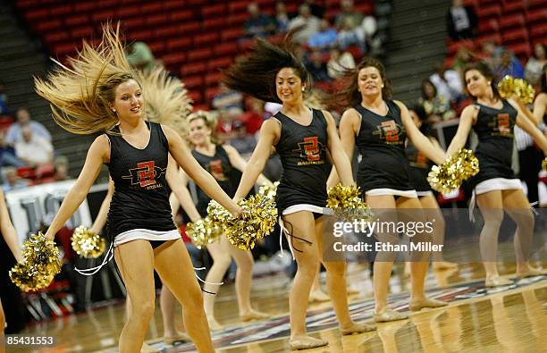 San Diego State Aztecs cheerleaders perform during the championship game against the Utah Utes in the Conoco Mountain West Conference tournament at...
