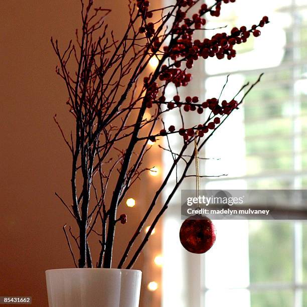 berries and branches and twinkle lights too - winterberry holly stock pictures, royalty-free photos & images