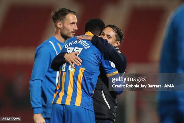 Arthur Gnahoua of Shrewsbury Town and Paul Hurst, Manager / Head Coach of Shrewsbury Town celebrate at full time during the Sky Bet League One match...