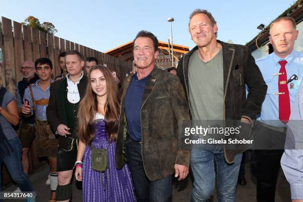 Arnold Schwarzenegger and Stella Glaubitz, granddaughter of Guenter Heinlein, attend the Oktoberfest at Theresienwiese on September 26, 2017 in...