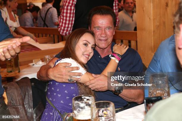 Arnold Schwarzenegger and Stella Glaubitz, granddaughter of Guenter Heinlein, attend the Oktoberfest at Schuetzen Festzelt at Theresienwiese on...