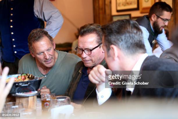 Ralf Moeller and Arnold Schwarzenegger with glasses attends the Oktoberfest at Kaefer Wies'n Schaenke at Theresienwiese on September 26, 2017 in...