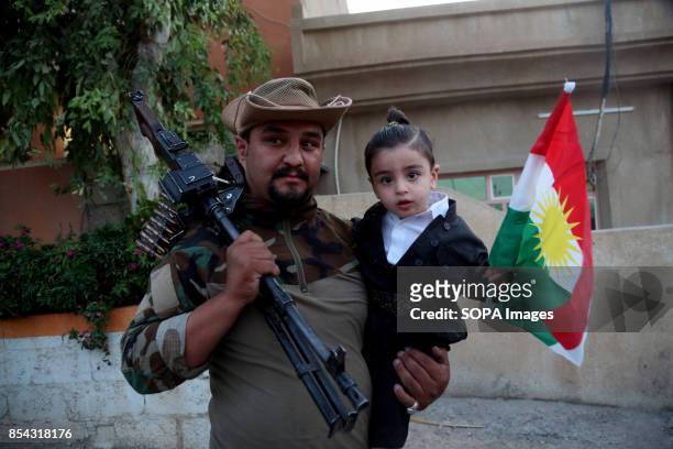 Kurdish Man and his boy are pictured while participating to the referendum. September 25, 2017 is a historic day for Kurdish people around the world...