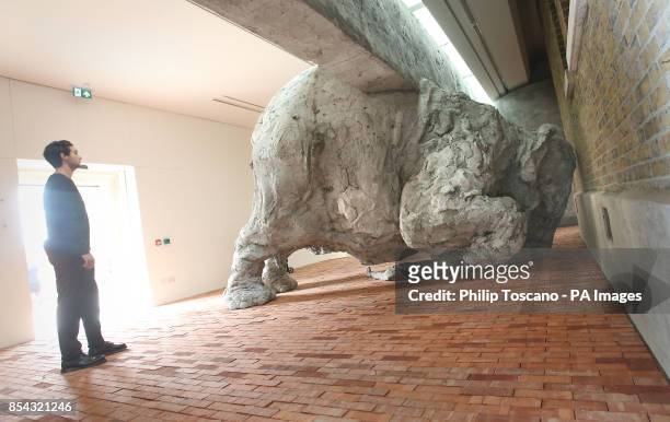 Visitor looks at a sculpture by Argentine artist Adrian Villar Rojas, who is the first to have his work shown at the new Serpentine Sackler gallery,...