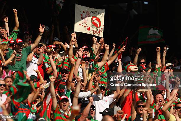 Rabbitohs fans celebrate a try during the round one NRL match between the Sydney Roosters and the South Sydney Rabbitohs at the Sydney Football...