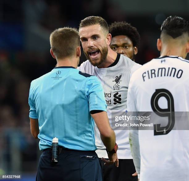 Jordan Henderson of Liverpool talks to Clement Turpin referee during the UEFA Champions League group E match between Spartak Moskva and Liverpool FC...