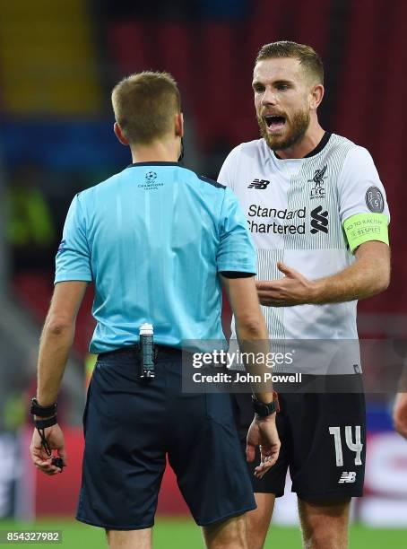 Jordan Henderson of Liverpool talks to Clement Turpin referee during the UEFA Champions League group E match between Spartak Moskva and Liverpool FC...