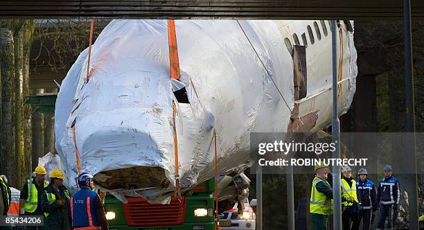 The wreck of a Turkish airlines Boeing 737-800 that crashed near Amsterdam two and a half weeks ago is transported to Schiphol airport on March 15,...