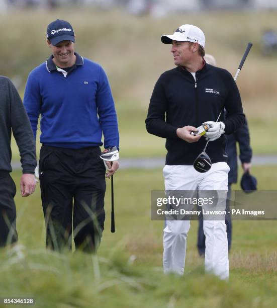 Shane Warne and Andrew Strauss during day Two of the 2013 Alfred Dunhill Links Championships at Carnoustie Golf Course.