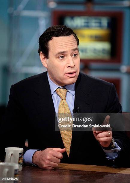 David Frum, columnist and former speechwriter for President George W. Bush, speaks during a live taping of 'Meet the Press' at NBC studios March 15,...