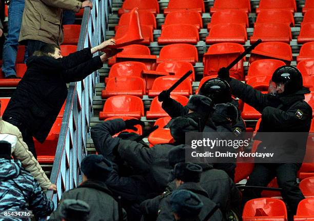 Russian police clash with Zenit Saint Petersburg fans during the Russian Football League Championship match between Spartak Moscow and Zenit at the...