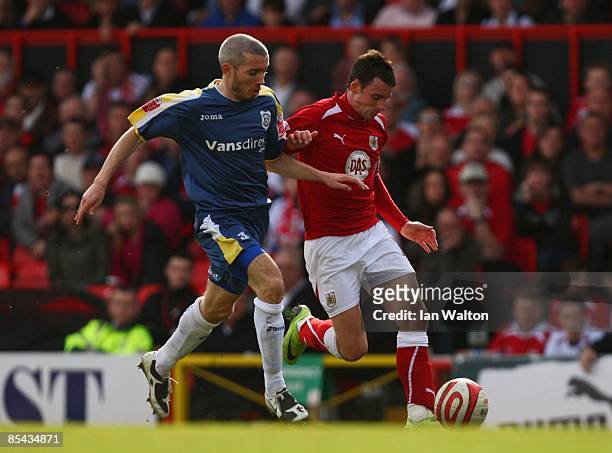 Kevin McNaughton of Cardiff City challenges Michael McIndoe of Bristol City during the Coca-Cola Championship match between Bristol City and Cardiff...