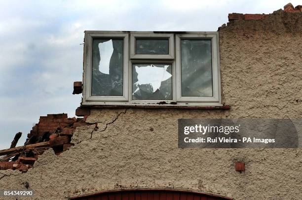 Demolition work begins on Mick and Mairead Philpott's old family home on Victory Road, Derby, where the two parents set a deadly fire which killed...