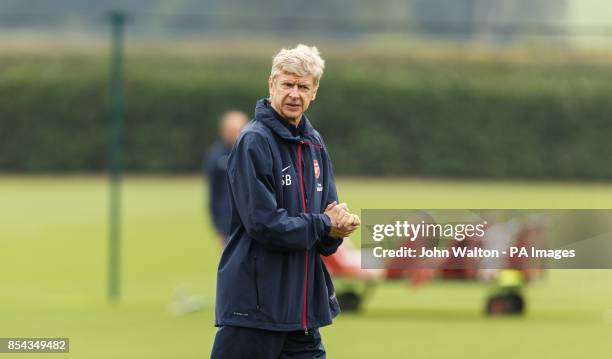 Arsenal's manager Arsene Wenger during a training session at London Colney, Hertfordshire.