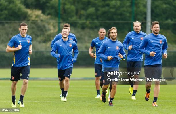 Arsenal's Thomas Vermaelen , Jack Wilshere and Mathieu Flamini during a training session at London Colney, Hertfordshire.