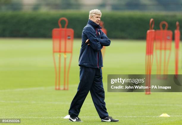 Arsenal's manager Arsene Wenger during a training session at London Colney, Hertfordshire.