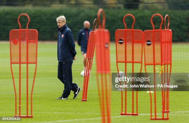 Arsenal's manager Arsene Wenger during a training session at London Colney, Hertfordshire.